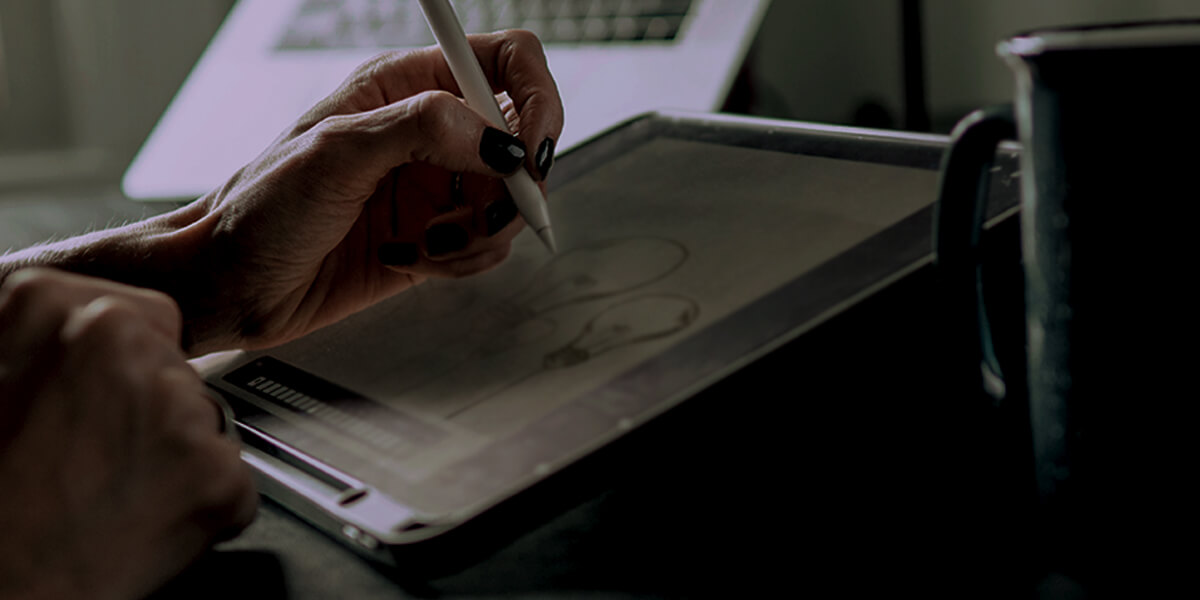 Woman sketching a logo